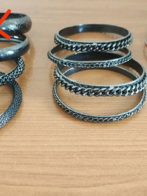 Stacking bangle bracelets used, 7 black metal and 2 colored