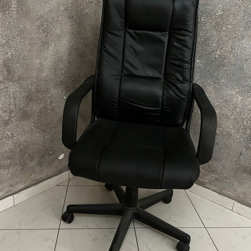 Black executive office chair with armrests and wheels