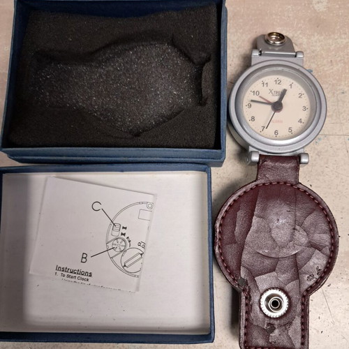 Travel alarm clock like new with leather cover