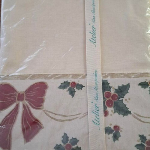Christmas tablecloth new with holly design and red bow
