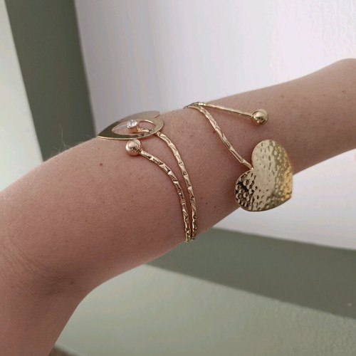 Cuff bracelet used with 2 gold-tone hearts