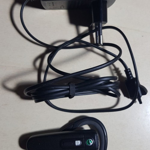 Sony Ericsson HBH-PV703 Bluetooth headset used with charger
