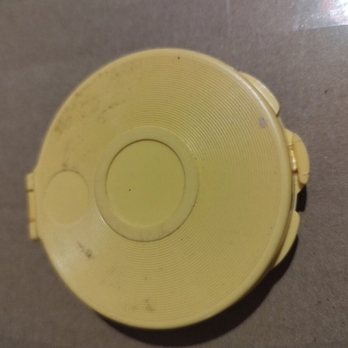 Powder compact from the 60s like new, yellow plastic with gold designs