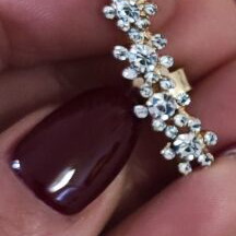 Earring like new, gold color with rhinestones