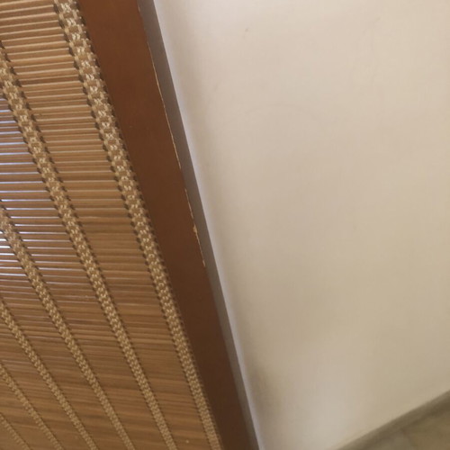 Brown bamboo room divider with slight wear