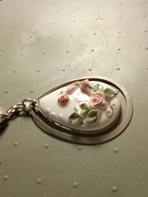 Handmade porcelain pendant like new with pink roses and ladybug