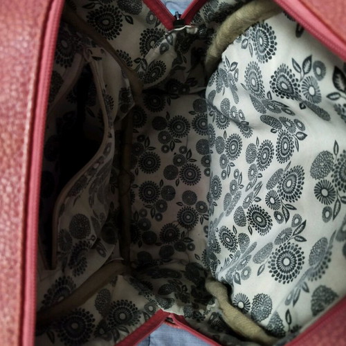 Backpack used red bag with quilted front zipper