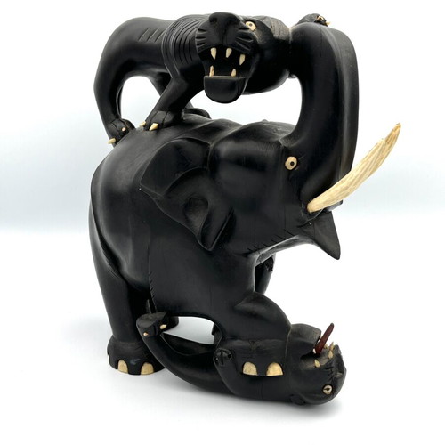 Vintage handmade ebony wood sculpture of elephant and lions
