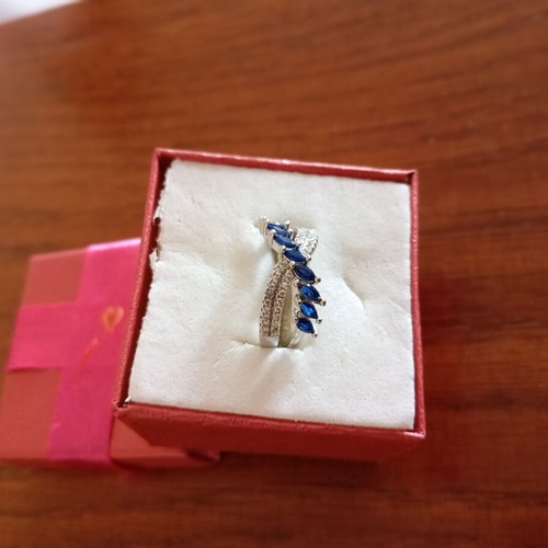 Ring new, gold plated with blue and silver zircon stones, size 7