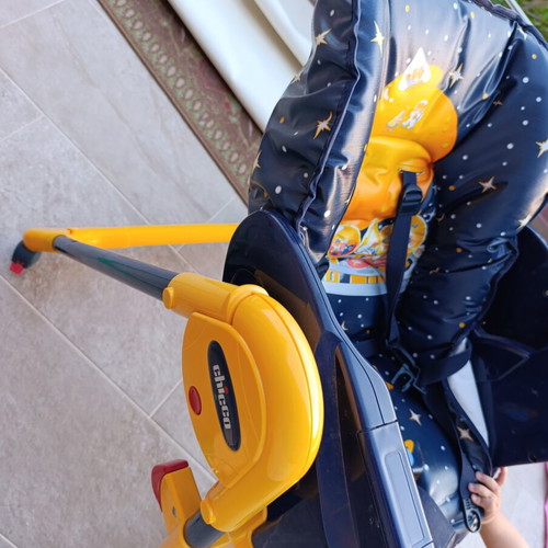 High chair used with plastic tear and stickers