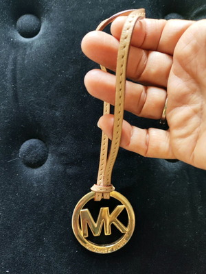 Michael Kors Leather Logo Charm like new, beige and gold bag keychain