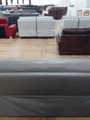 Gray leather three-seater sofa new