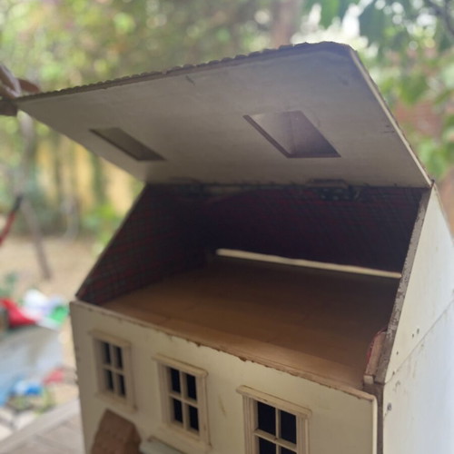 Vintage wooden dollhouse used with unique architecture