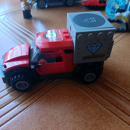 Lego set used with truck, helicopter, and motorcycle