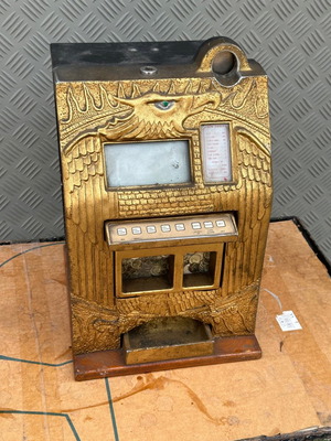 Old metal and wood electronic slot machine used for decoration