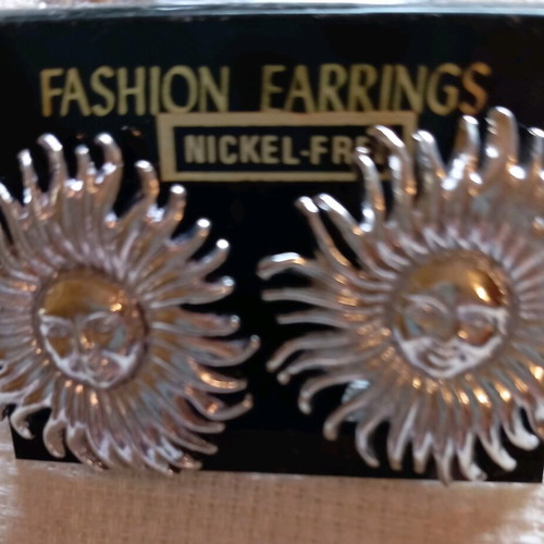 Clip-on earrings new, silver sun design