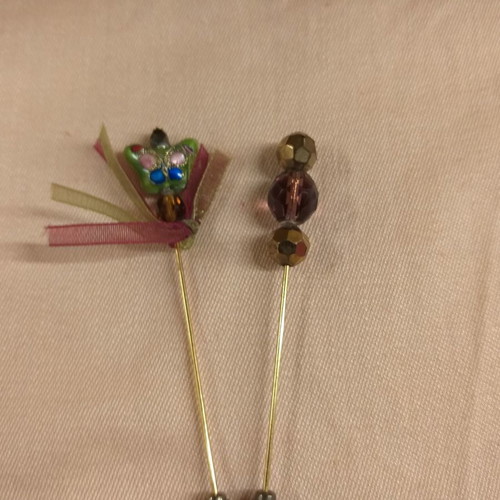 Lapel pins used, two small with enameled detail