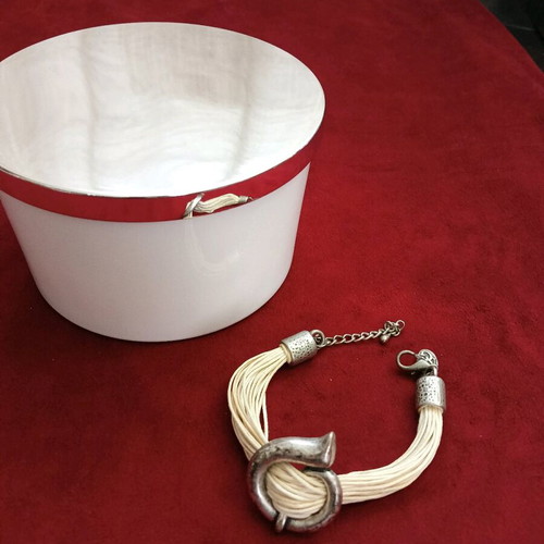 Bracelet with beige cords and metal elements like new