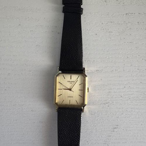 Orient VX Quartz watch, vintage gold rectangular case, brown leather strap