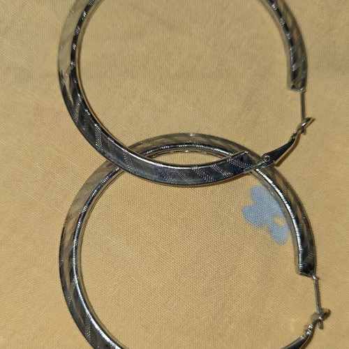 Hoop earrings like new, grey color, unknown material