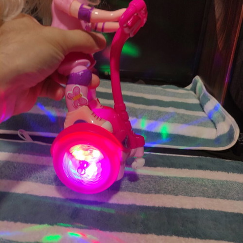 Doll with scooter, sound and lights, like new
