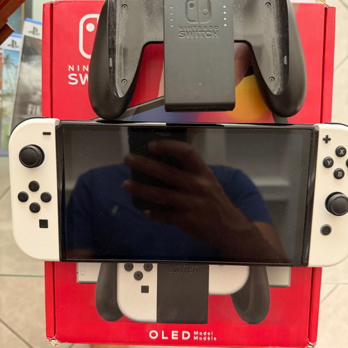 Nintendo Switch OLED like new with accessories and two games