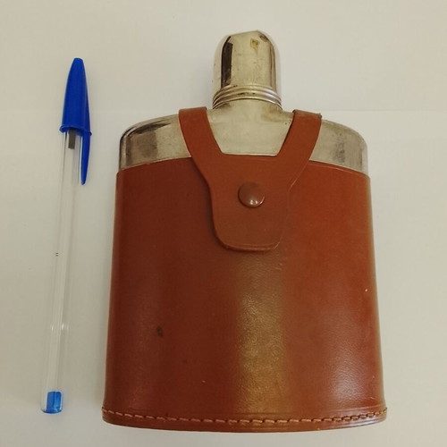 Vintage glass and metal pocket flask for alcohol in leather case used