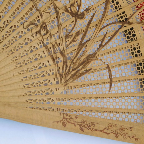 Traditional Chinese sandalwood fan with decorative tassel