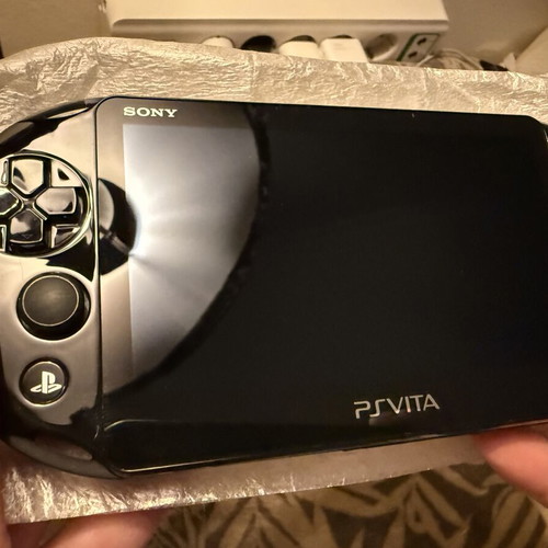 PS Vita Slim Model 2004 handheld console, brand new