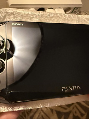 PS Vita Slim Model 2004 handheld console, brand new