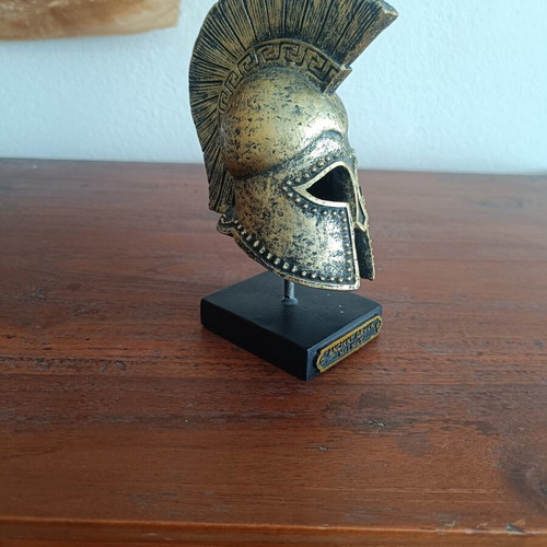 Decorative replica of ancient Greek Corinthian helmet used, bronze patina
