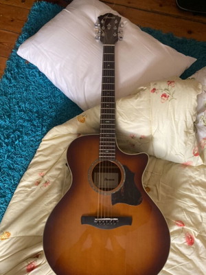 Ibanez folk acoustic guitar with crack on table