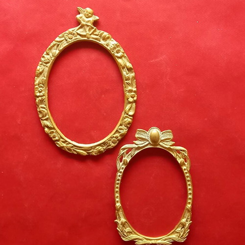 Set of two brass frames