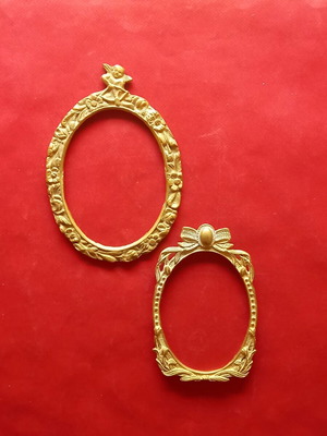 Set of two brass frames
