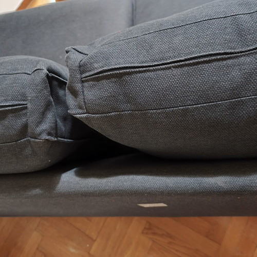 Two-seater fabric sofa used, dark gray color with visible marks