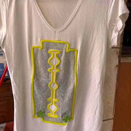 Women's white short-sleeve blouse with razor blade design, size S used