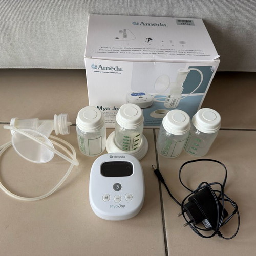 Ameda Mya Joy single breast pump like new with extra bottles