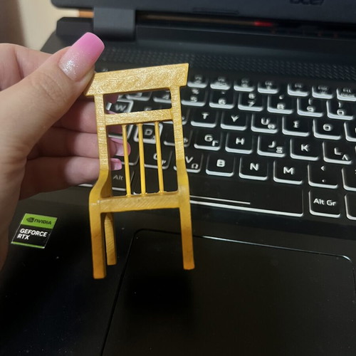 Miniature yellow chair used