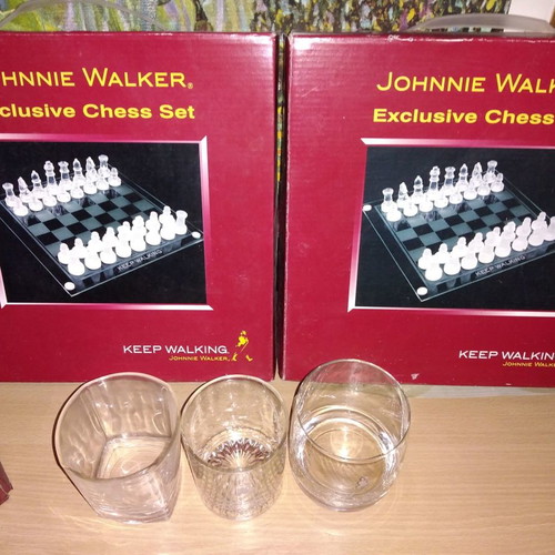 Johnnie Walker collectible set new with chess, whiskey glasses, and metal box