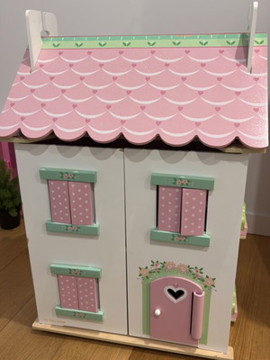 Wooden dollhouse like new