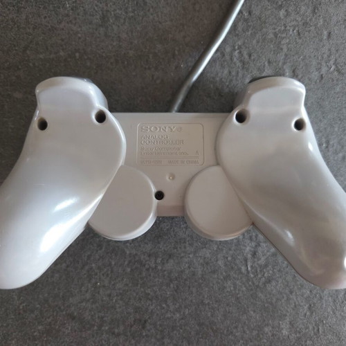 Sony PlayStation SCPH-7502 PS1 console used with Dualshock controller