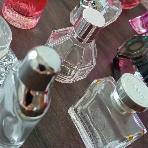 Collection of 29 empty perfume miniatures like new
