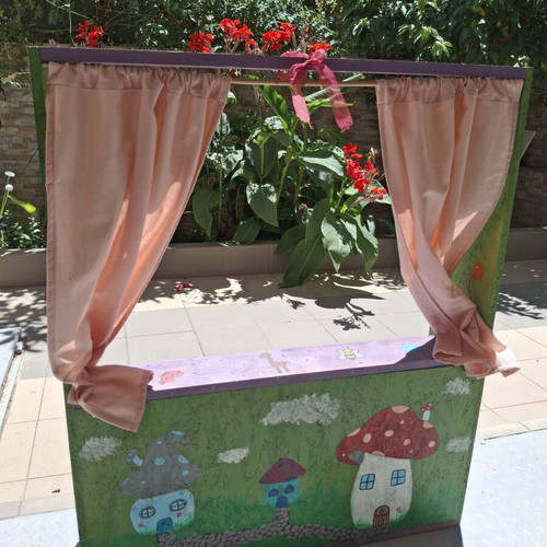 Handmade wooden puppet theater with hand-painted details and puppets like new