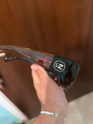 Sunglasses used, brown color