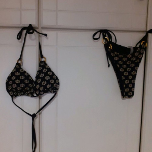 Shein bikini swimsuit used black with white embossed flowers and gold rings