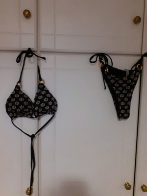 Shein bikini swimsuit used black with white embossed flowers and gold rings