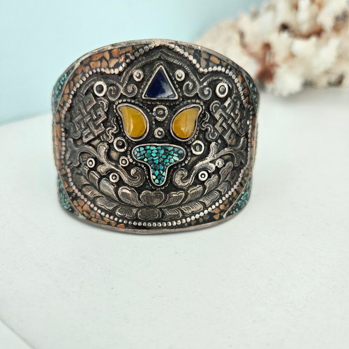 Handmade carved bracelet used with turquoise and silver