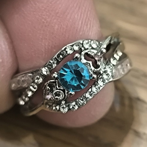 Silver vintage ring with blue zircon and white stones