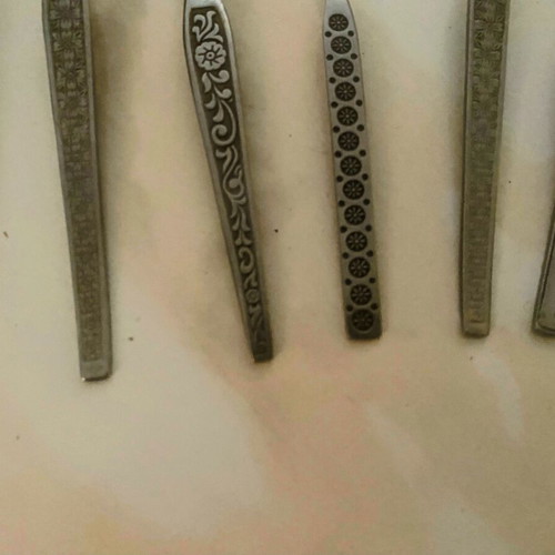 Vintage cutlery set used, 9 pieces with decorative designs