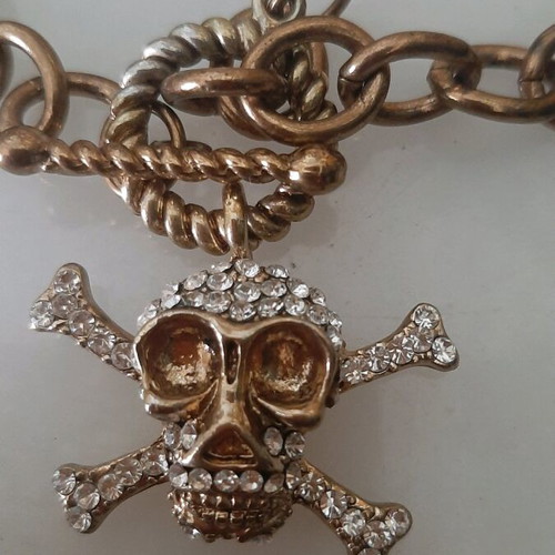 Necklace used pink gold color with skull design